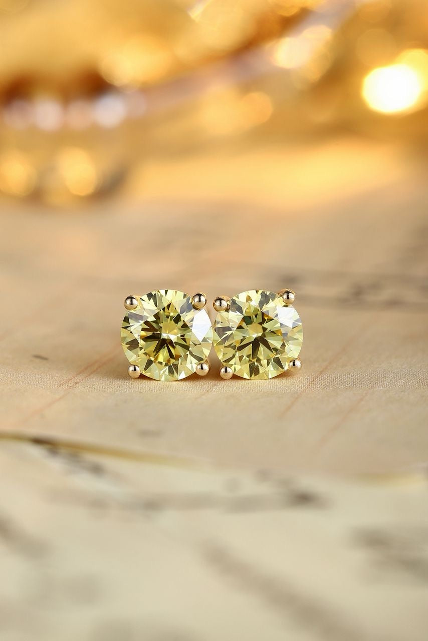 Diamond stud earrings by RIAZ