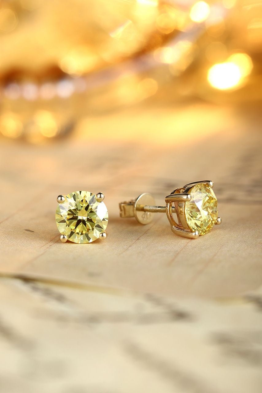 Diamond stud earrings by RIAZ