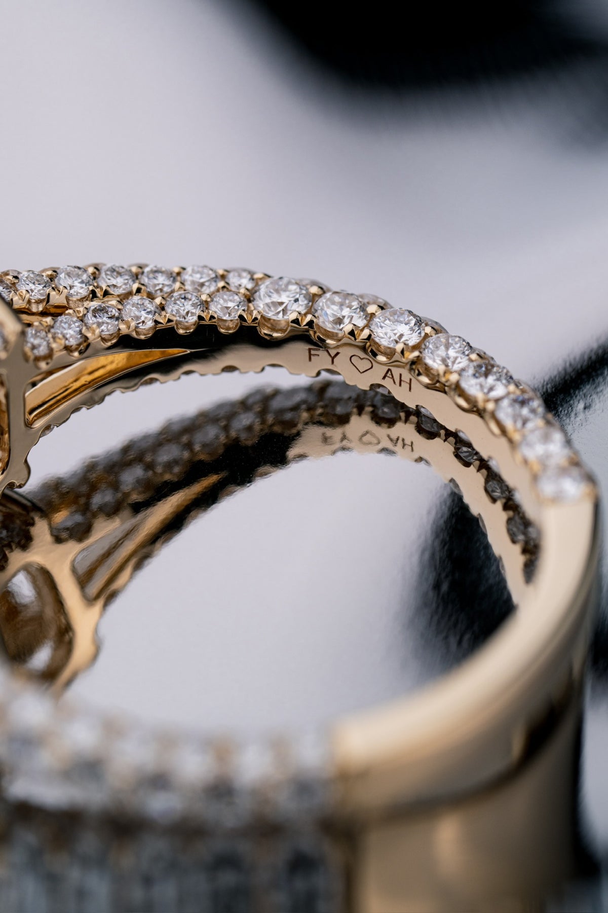 Personal engraving detail inside a custom radiant-cut diamond engagement ring by RIAZ